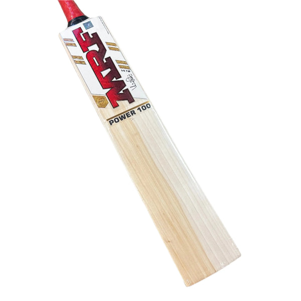 Wooden cricket bat with red and white branding on a textured surface